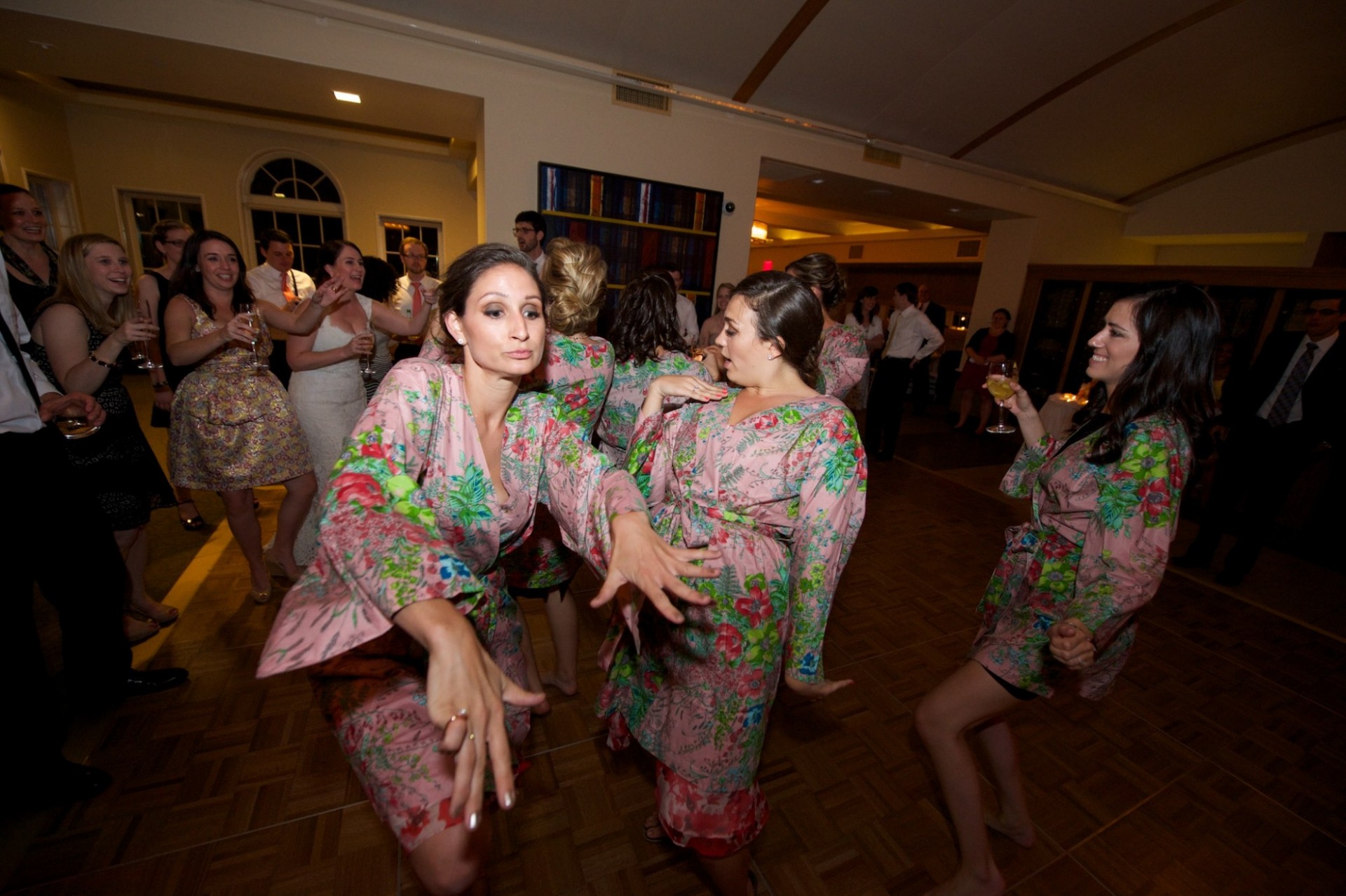 a photo of bridesmaids dancing at a wedding.