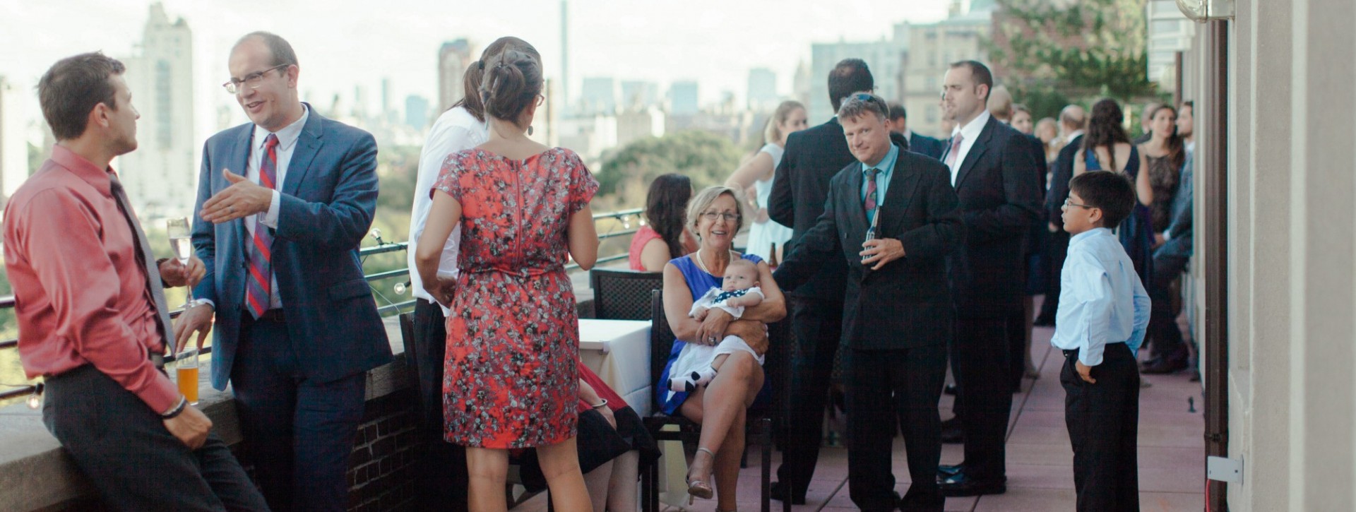 family enjoying a social event together on the Skyline Terrace,