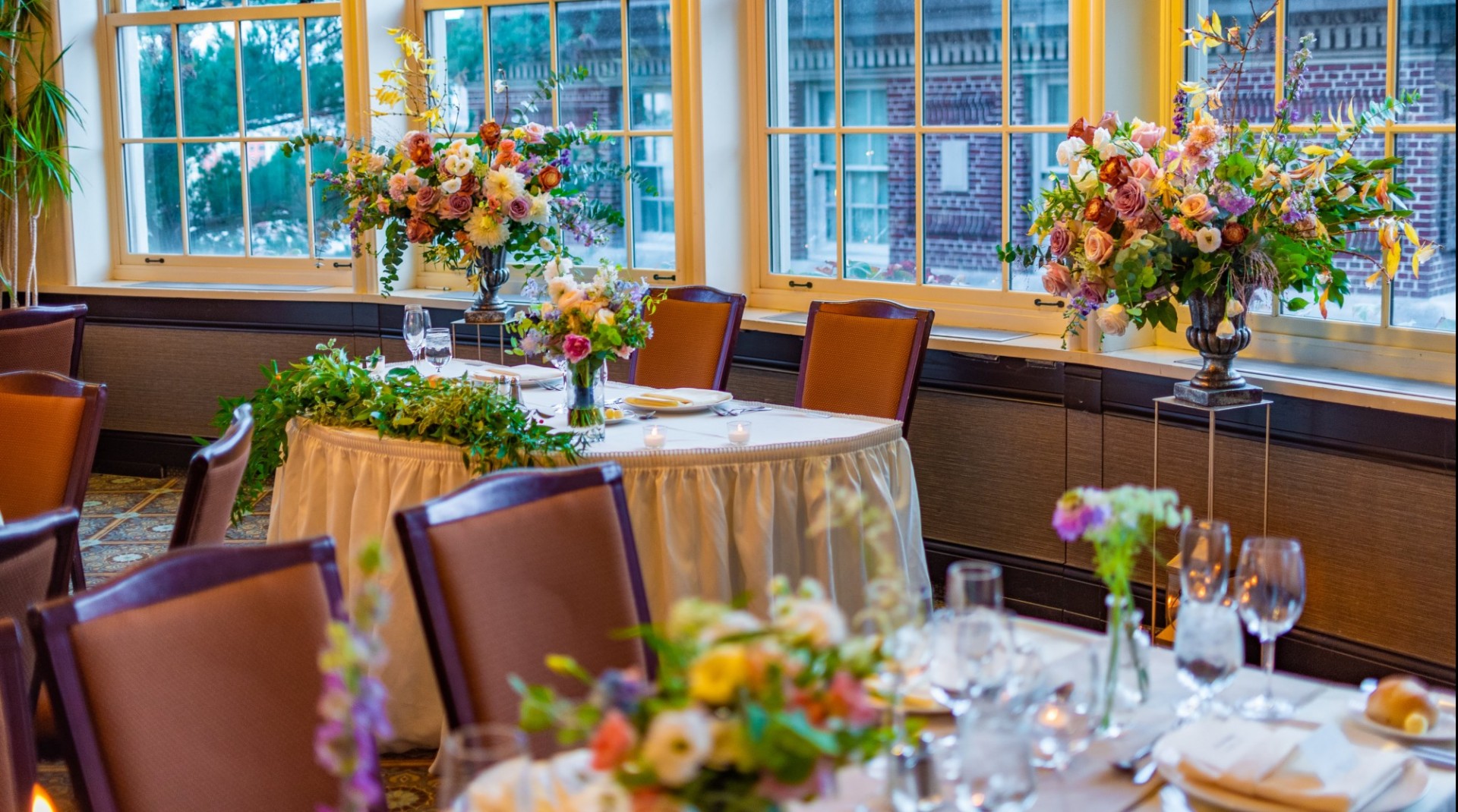 Colorful flowers adorn the sweetheart table