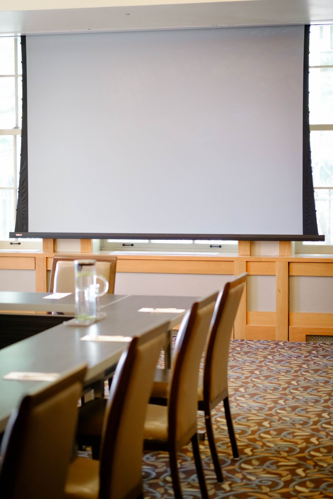 A projector screen and seating in Garden Room 1