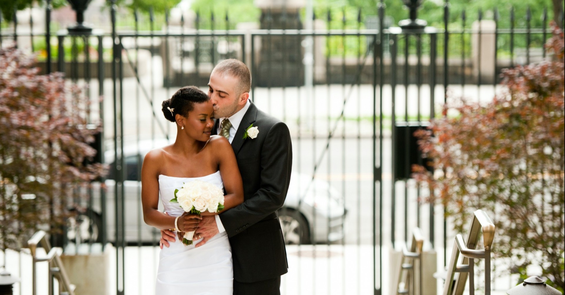 A bride and groom embrace