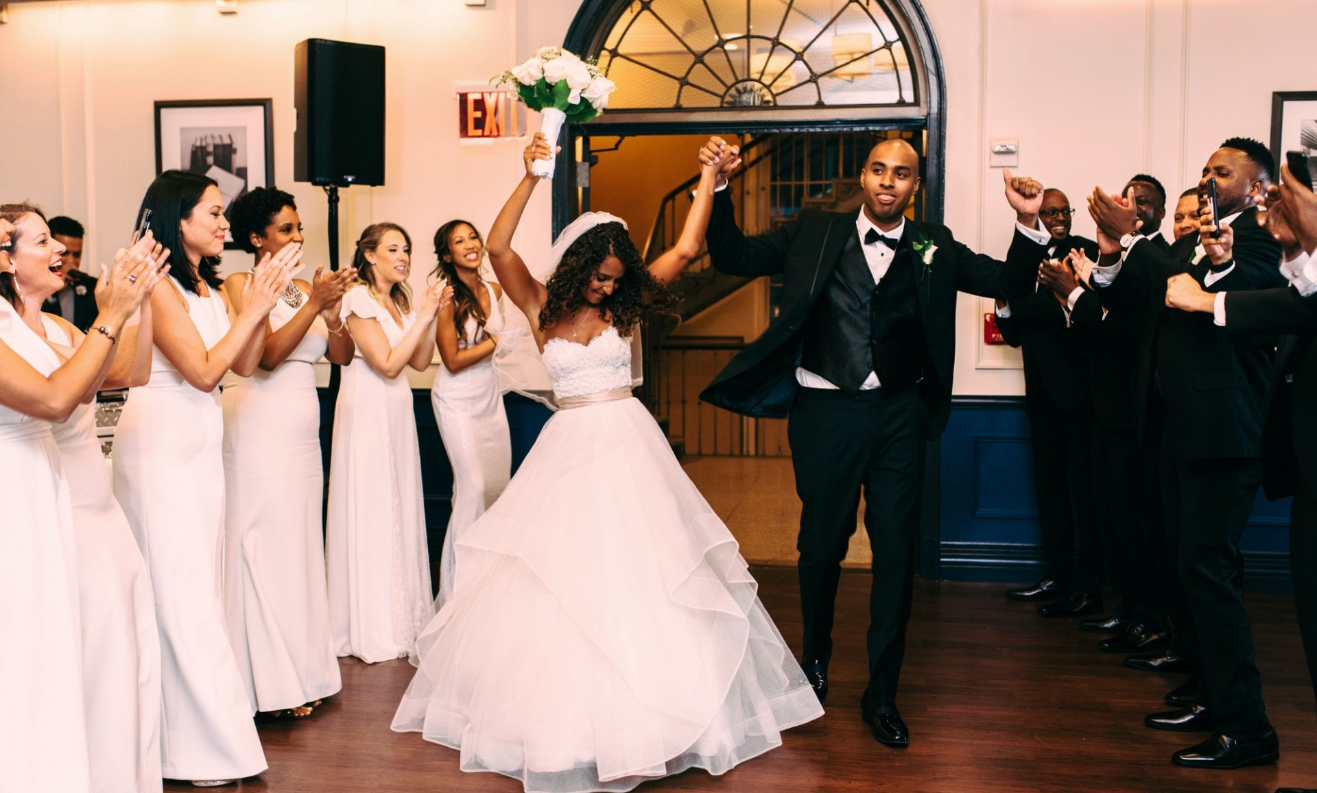 This couple entered the reception ready to have some fun.