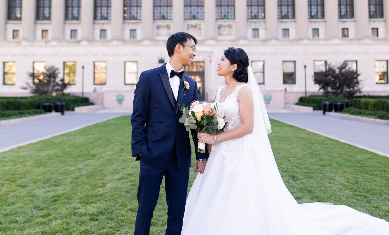 A couple poses for a photo in front of Columbia University's Butler Library. Columbia's campus provides a wealth of beautiful settings for photos.