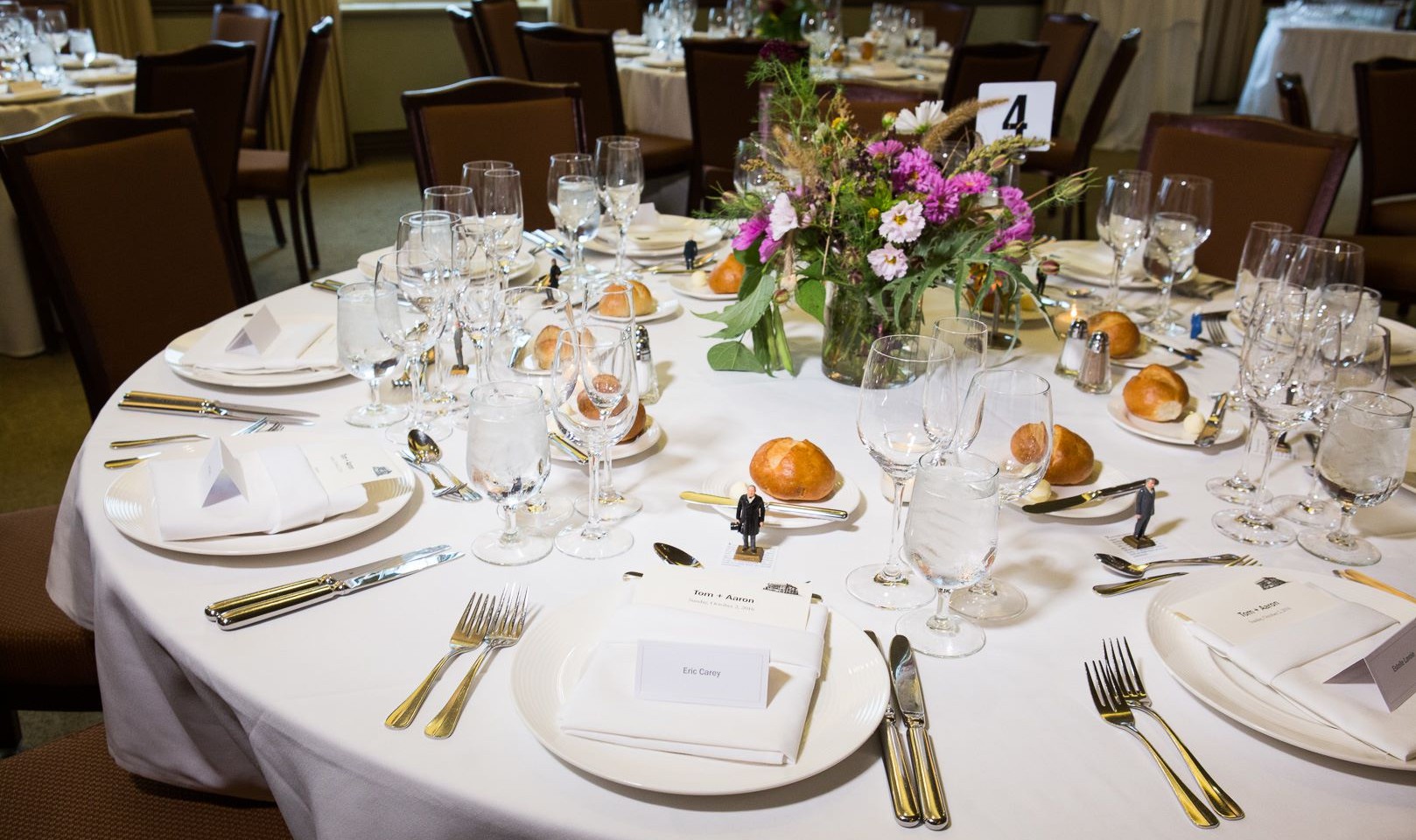 Simple and beautiful place settings with fresh wildflowers.