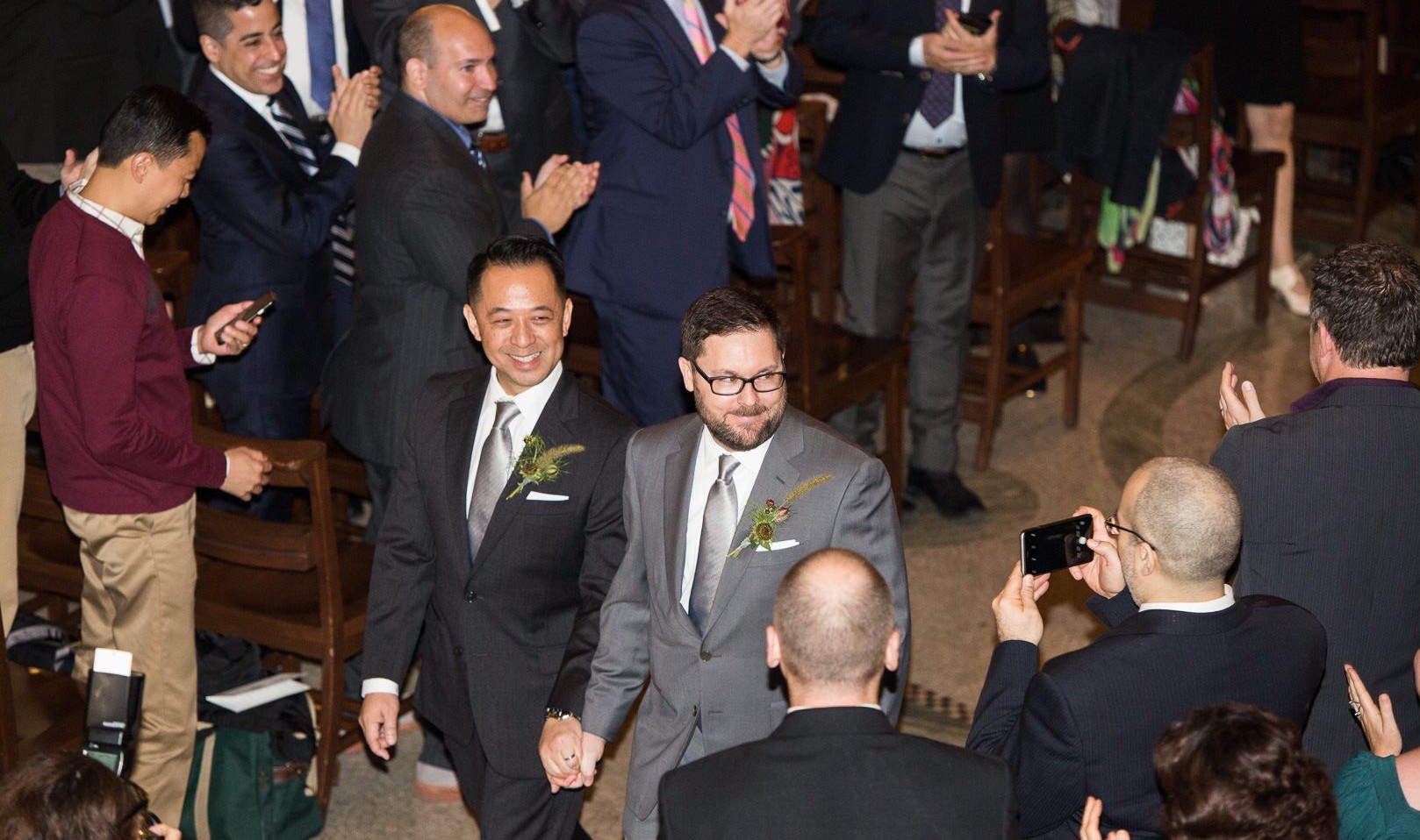 Our happy grooms making their way back down the aisle at Saint Paul's Chapel. Our happy grooms making their way back down the aisle at Saint Paul's Chapel.
