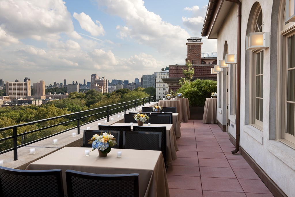 The Skyline Terrace at Faculty House decorated with votive candles and fresh floral arrangements