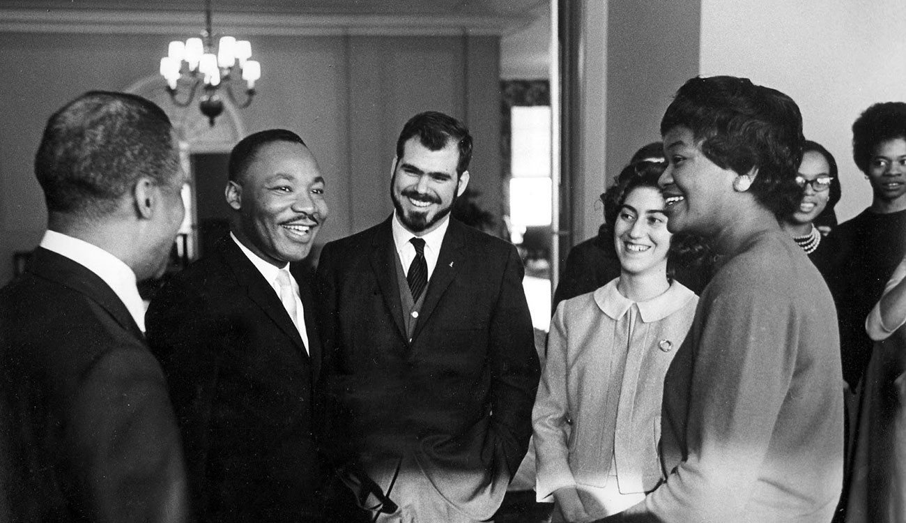 Martin Luther King, Jr., with "Owl" editor Wally Wood '88GS (center) and other students. Photo by Lawrence J. Howell, courtesy of Wally Wood.