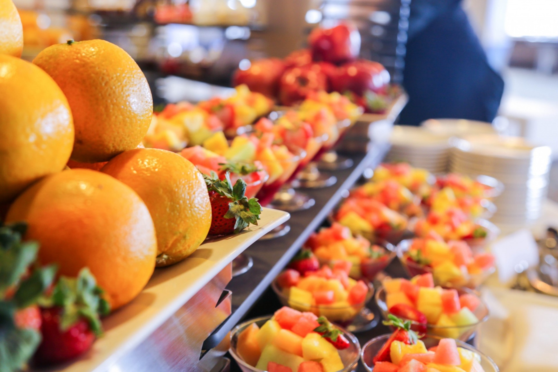 A beautiful selection of fresh fruits and fruit cups.