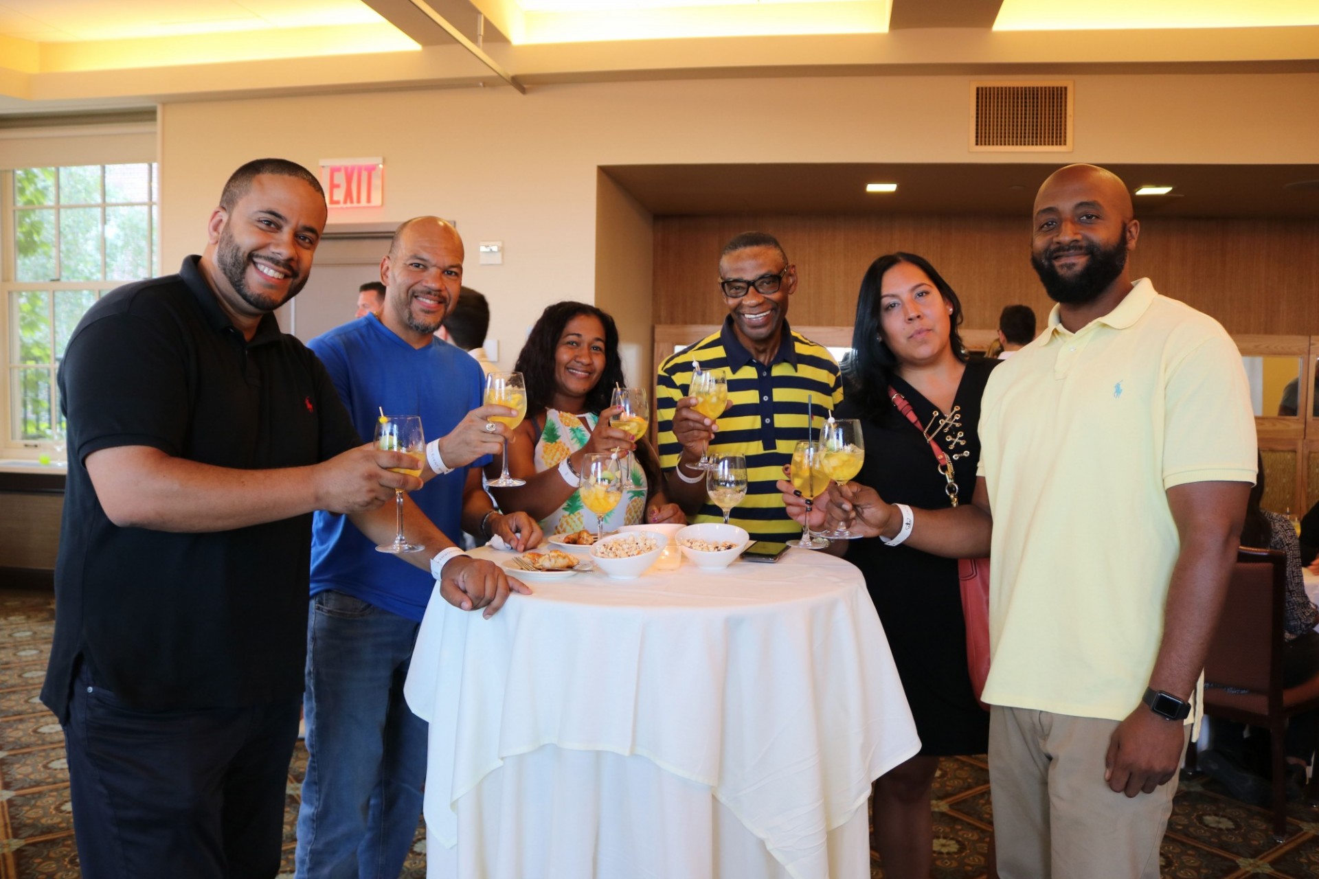 A group sharing a toast at a social event.