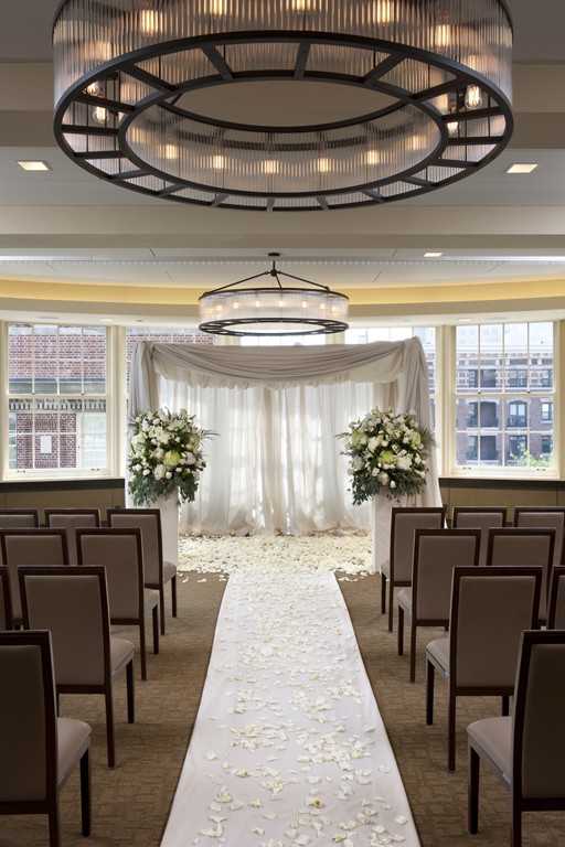The Skyline Level dining room set for a wedding ceremony