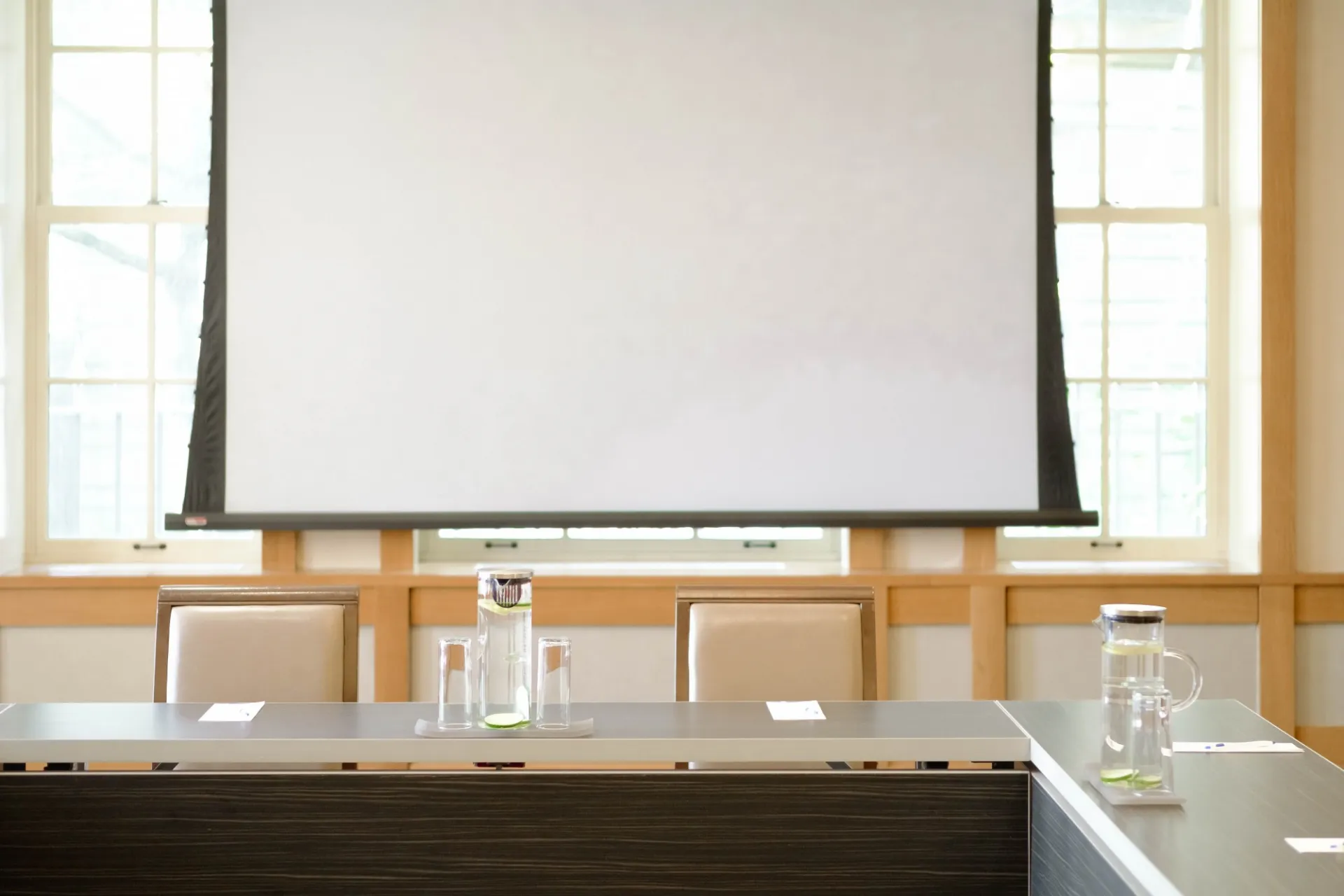 A projector screen and seating in Garden Room 1