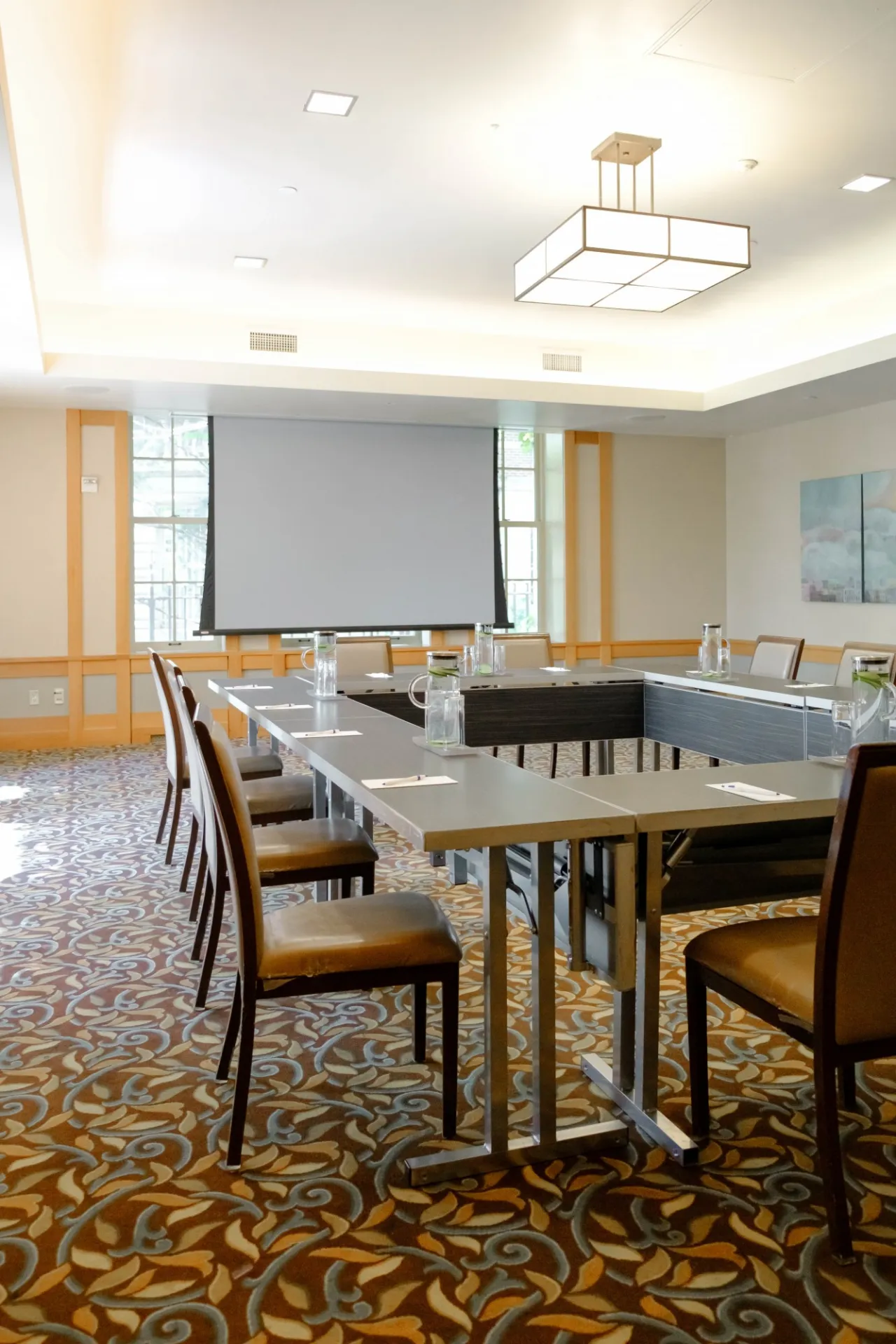 A projector screen and seating in Garden Room 1