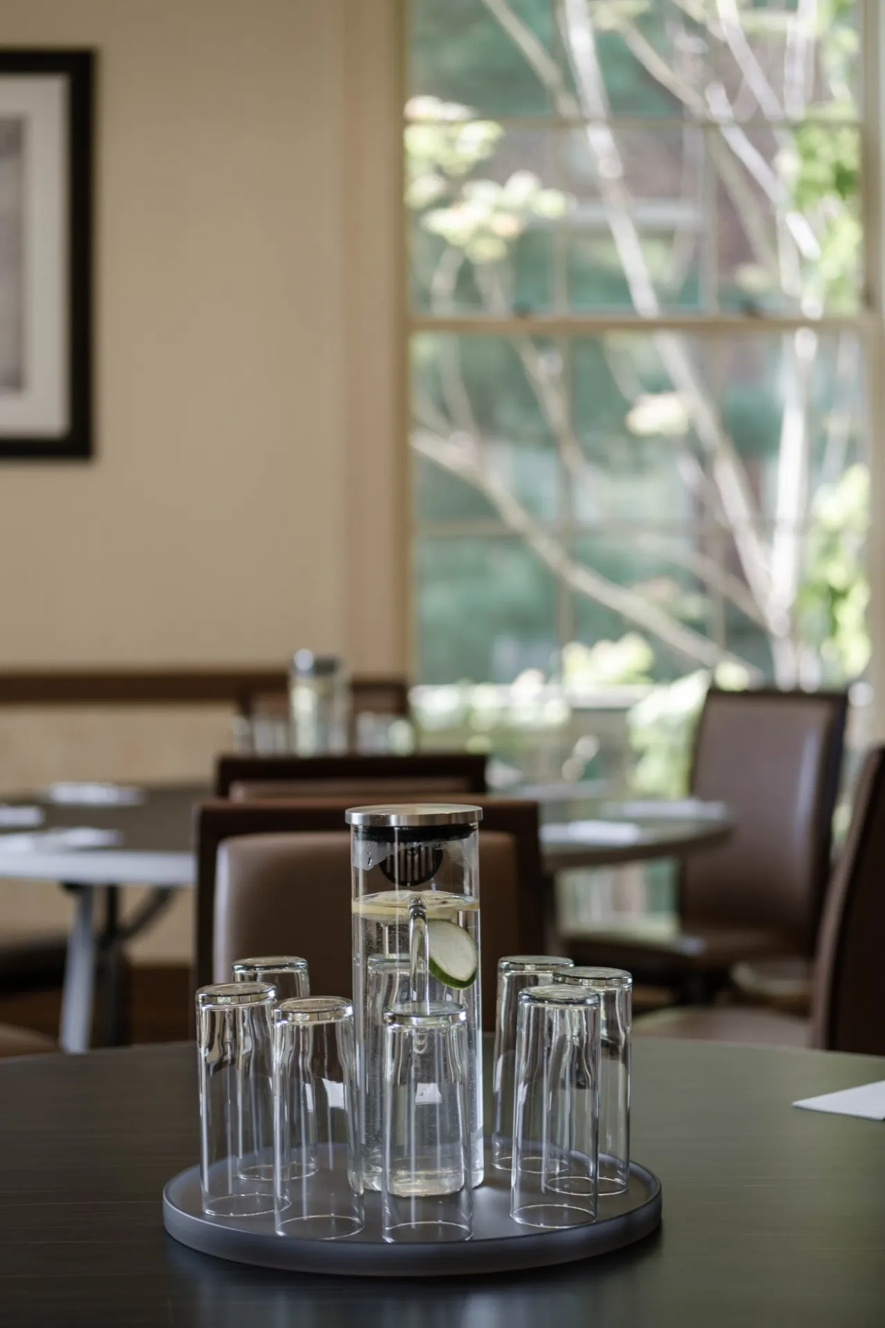 Water glasses sit on a banquet round in Seminar 2
