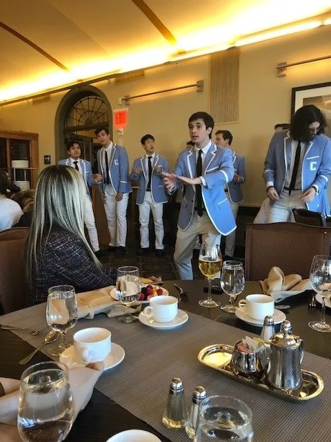 An acapella group from Columbia performs for a luncheon at the Faculty Dining Room.