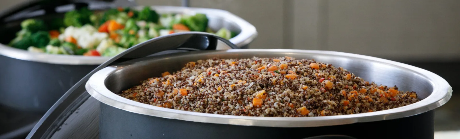 Buffet serving rice pilaf and mixed vegetables