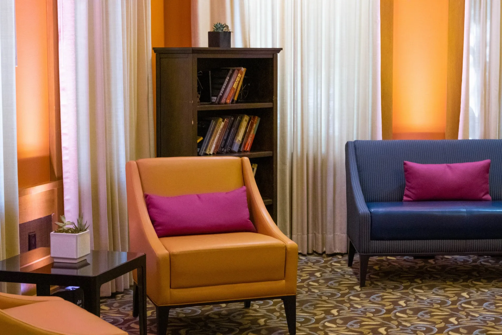 Seating near a bookshelf in the Ivy Lounge