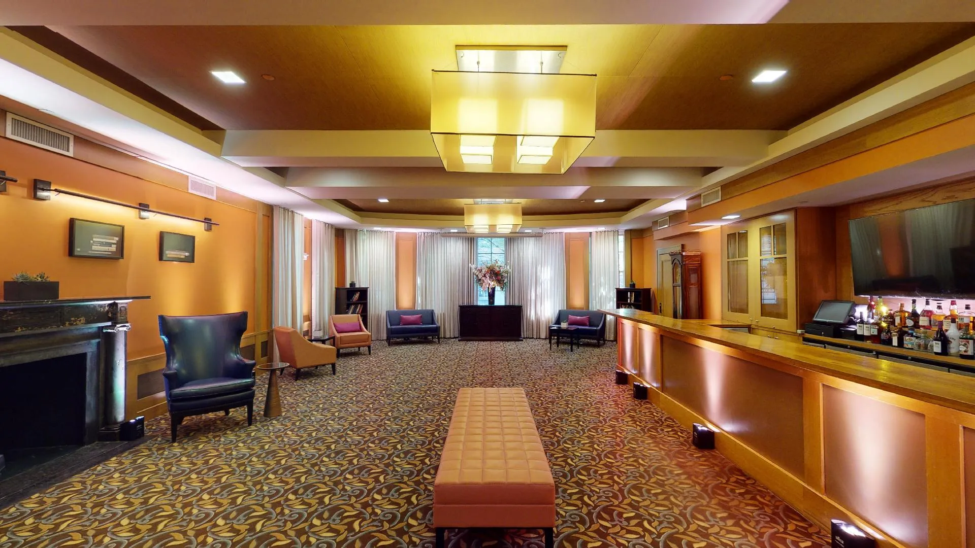 The Ivy Lounge features a bar, fireplace and ample seating
