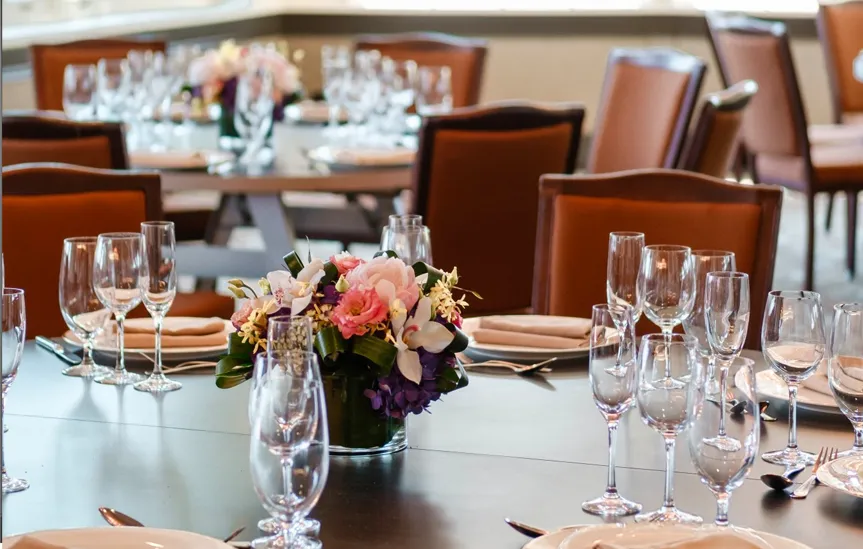 The dining room with tables set for lunch. 