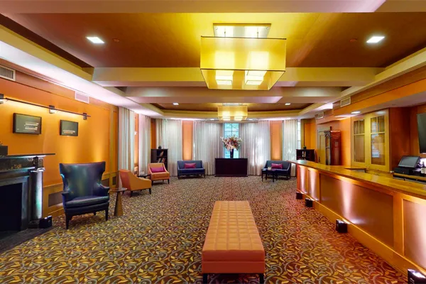 The Ivy Lounge features a bar, fireplace and ample seating.
