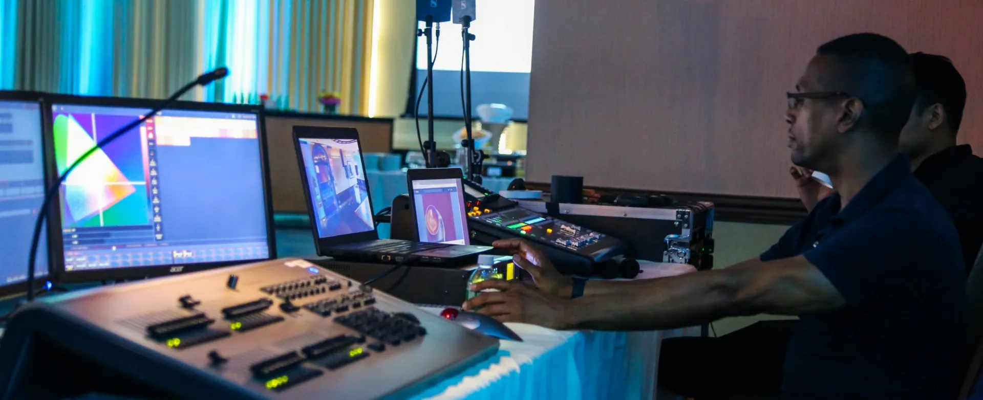 A photo of technical services staff set up for an event.